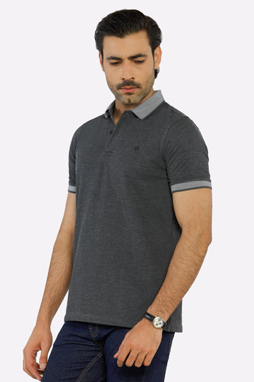 A man wearing a blue jacquard collar polo shirt with short sleeves, displayed against a plain background.